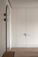 Modern interior with a closed door and minimal decor
