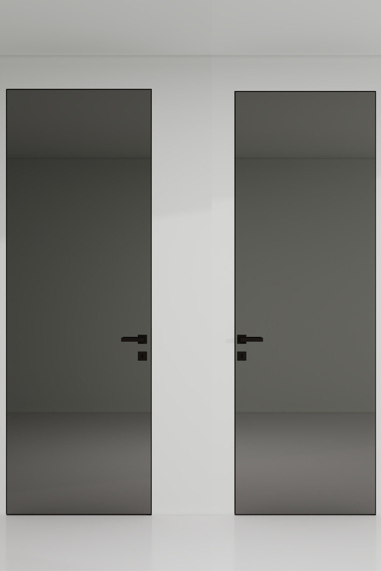 Two black doors with handles on a white wall.
