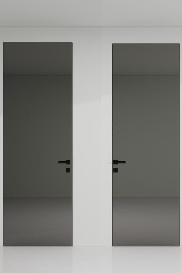 Two black doors with handles on a white wall.