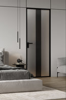 Modern bedroom with a bed, nightstand, and decorative items.